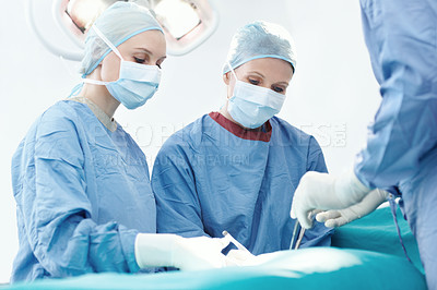 Buy stock photo Surgery, hospital and doctor assistant in operating room for patient, emergency or operation. Healthcare people, collaboration and medical surgeons with surgical tools, teamwork and clinic service