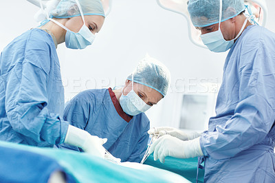 Buy stock photo People, cutting or surgeons in hospital for surgery, emergency accident or healthcare in clinic theatre. Medical, mask or doctors in surgical scrubs in operating room for teamwork, operation or help