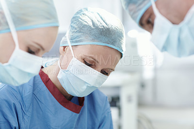 Buy stock photo People, mask or surgeons in operation for surgery, emergency accident or healthcare in hospital theatre. Medical, clinic or doctors in surgical scrubs in operating room for teamwork, cutting or help