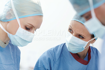 Buy stock photo Medical, people or surgeons in operation for surgery, emergency accident or healthcare in hospital theatre. Mask, group or doctors in surgical scrubs in operating room for teamwork, support or help