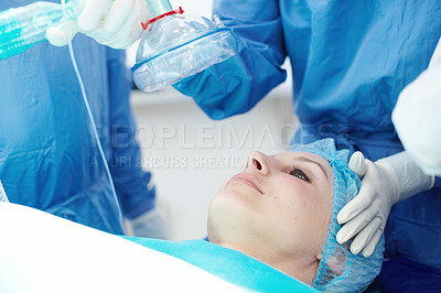 Buy stock photo A female patient going under general anaesthetic in a hospital