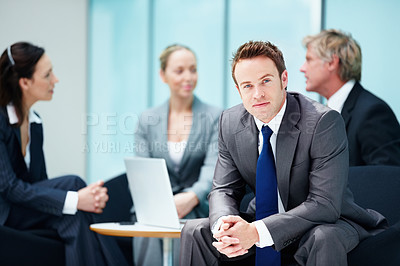 Buy stock photo Portrait of confident business man with executives discussing in background
