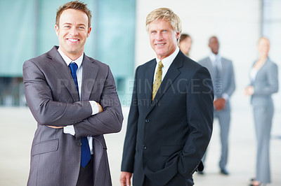 Buy stock photo Portrait of smiling business men with colleagues in background