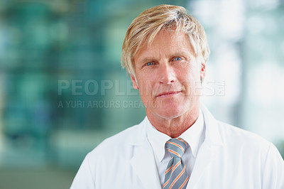 Buy stock photo Portrait, doctor and mature man in clinic, healthcare and smile with career ambition. Face, employee and consultant in workplace, professional and wellness center with pride and medical advisor