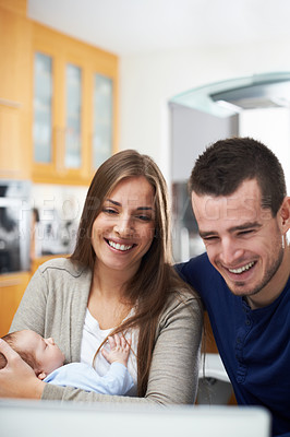 Buy stock photo A young couple and their newborn baby