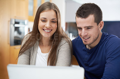 Buy stock photo Couple, smile and laptop in home for movie, streaming online or news check on couch in living room. Film, internet subscription and happy people on technology to relax on digital website together