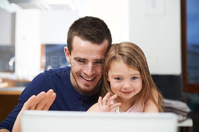 Buy stock photo Father, child and hello on laptop for video call, talking or online communication in home. Kid, dad or parent with wave greeting on technology for virtual conversation, family or bonding together