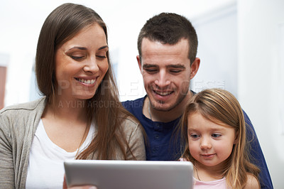 Buy stock photo Home, father and mother with girl for tablet, educational video and streaming service for cartoon. House, dad and mom with child for game subscription, ebook or bonding with entertainment application