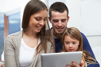 Buy stock photo A family using their new digital pad