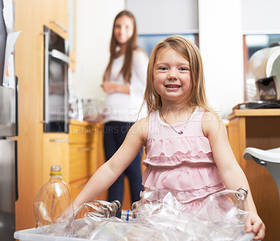 Buy stock photo Portrait, kid and container of recycle plastic for cleaning process, recycling trash and house pollution. Smile, child and helping mother with waste removal, eco friendly activity and teaching habits