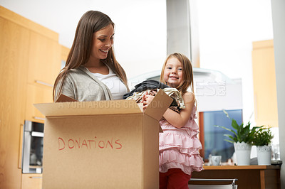Buy stock photo Mother, kid and helping with box for donation of charity support, community service and volunteer project. Family, woman and girl with cardboard for giving process, poor outreach and bonding at house