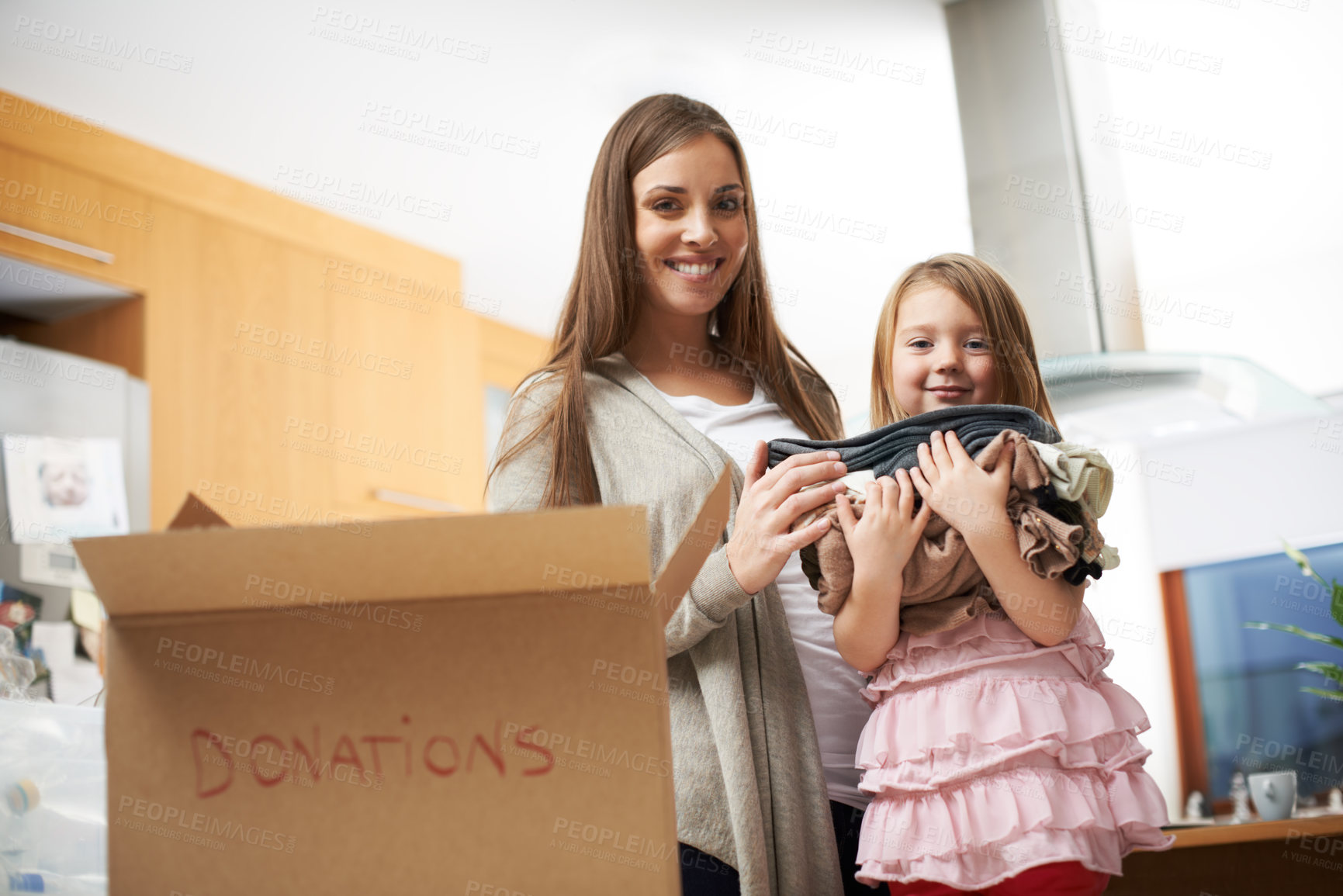 Buy stock photo Portrait, family and clothes in box for donation of charity support, community service and volunteer project. Woman, girl and help with cardboard of giving process, poor outreach and bonding at house