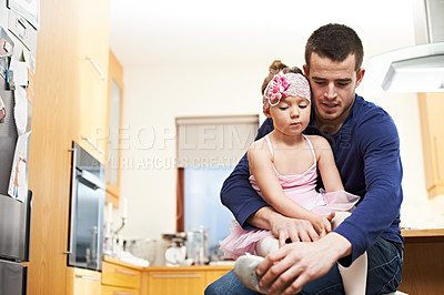 Buy stock photo Ballet, help and shoes with father and daughter in kitchen for dance practice, support or bonding. Ballerina, child development and growth with man and young girl in family home for love and dressing