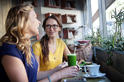 Buy stock photo Cropped shot of girlfriends in a coffee shop