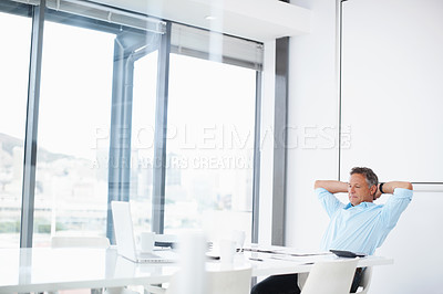Buy stock photo A mature advertising executive thinking about his next ad campaign