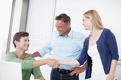 Buy stock photo A young woman being introduced to the rest of the ad team