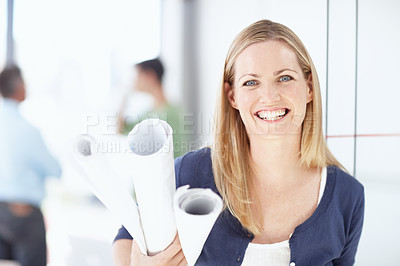 Buy stock photo Portrait of a young architect holding her blueprints in her hand