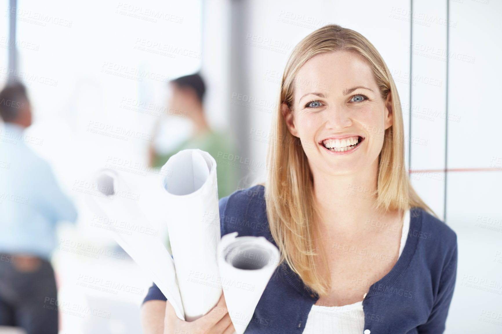 Buy stock photo Portrait of a young architect holding her blueprints in her hand