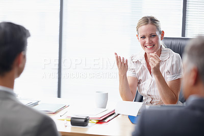 Buy stock photo A young business manager having a meeting with two colleagues in her office - Copyspace