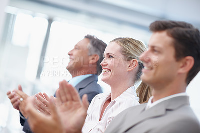 Buy stock photo A trio of businesspeople applauding a brilliant presentation