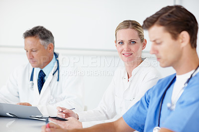 Buy stock photo Doctors, woman and meeting with people in hospital for patient treatment plan, consulting and healthcare. Diagnostic advice, medical intern and nurse with team in clinic for test results and review