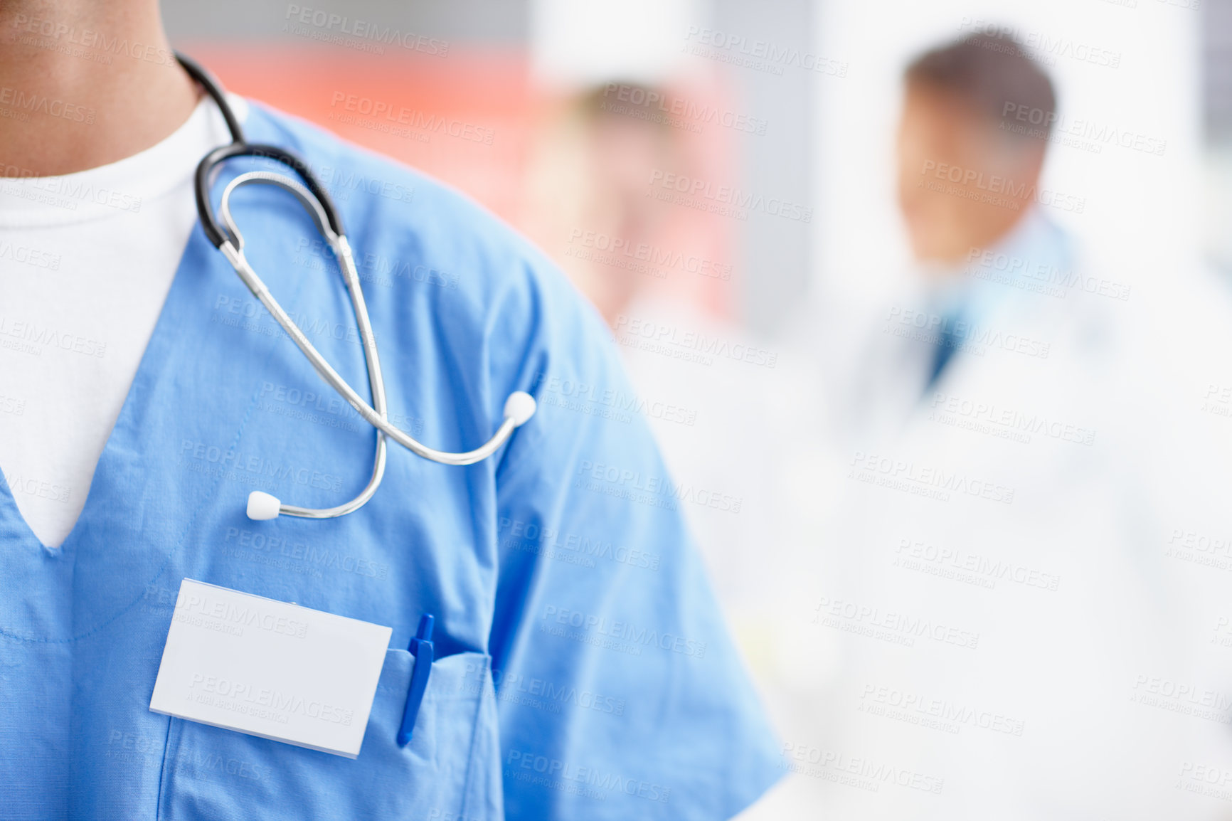 Buy stock photo Cropped image of a male surgeon wearing a nametag alongside copyspace