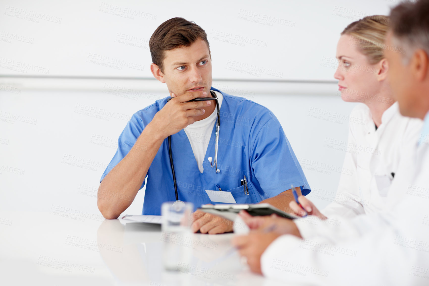 Buy stock photo Doctors, man and discussion at clinic for planning, confused and problem solving in boardroom. People, surgeon and team with meeting, brainstorming and advice for surgery with healthcare at hospital