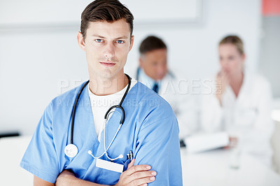 Buy stock photo A young surgeon standing alongside copyspace with crossed arms