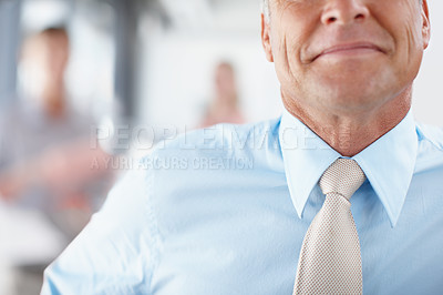 Buy stock photo Cropped image of a senior businessman smiling and wearing a tie