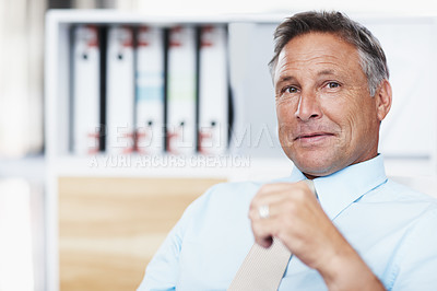 Buy stock photo Portrait of a respected business manager sitting at his desk - Copyspace