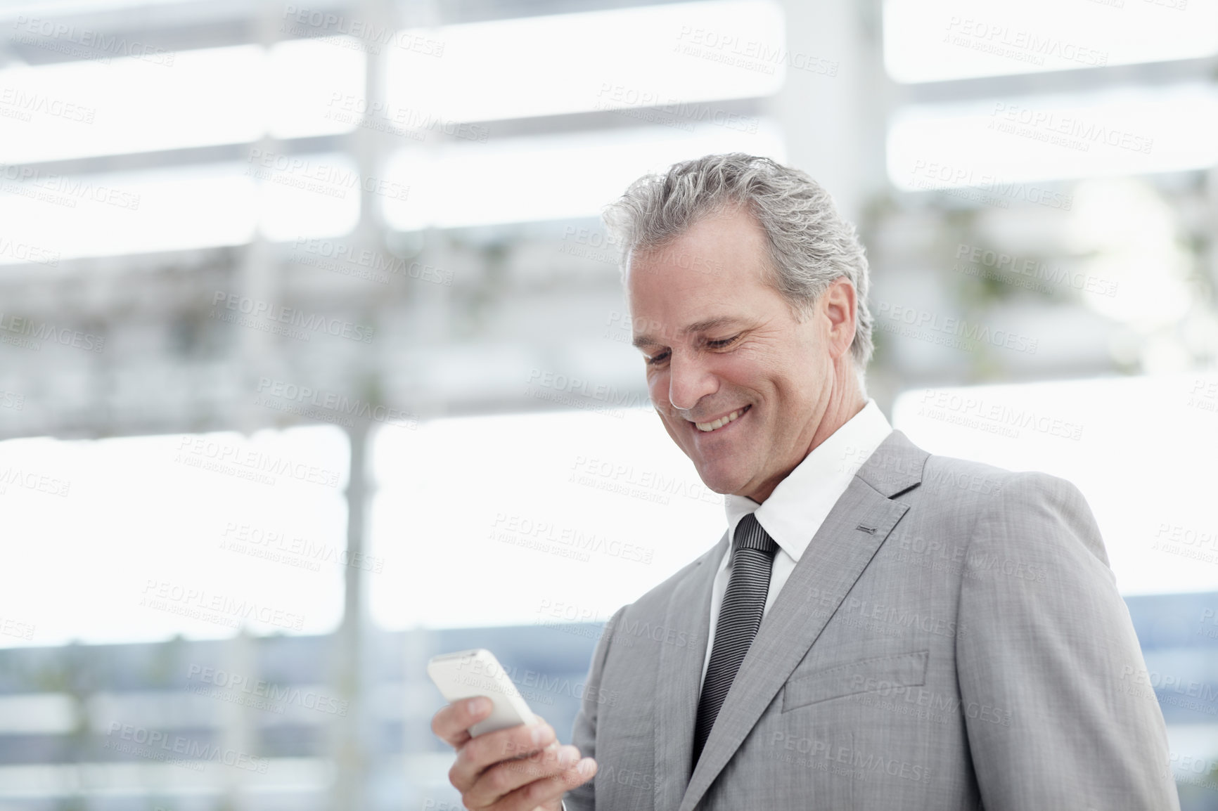 Buy stock photo Phone, smile and mature man in office with business, online report or checking schedule. Boss, corporate manager or CEO businessman on smartphone for communication, networking and chat on mobile app