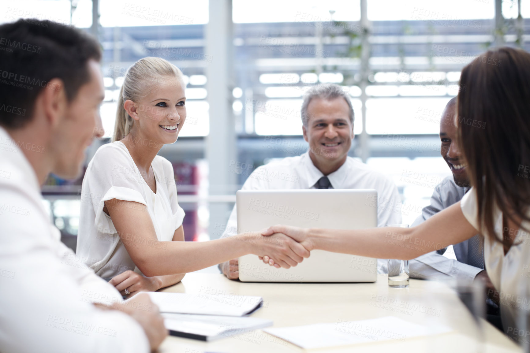 Buy stock photo Shot of a group of business people in a meeting