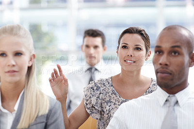 Buy stock photo A businesswoman raises her hand in a seminar