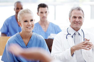 Buy stock photo Doctors and nurses in a seminar together