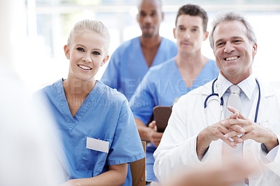 Buy stock photo Doctors and nurses in a seminar together