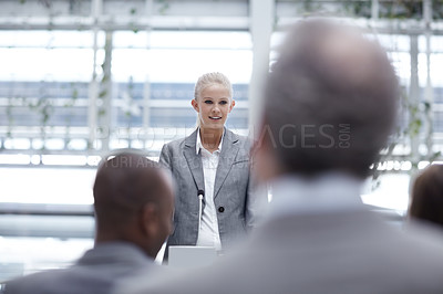 Buy stock photo A beautiful young businesswoman giving a speech to her colleagues at a conference
