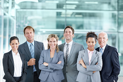Buy stock photo Confident group of businesspeople standing together and smiling - portrait 