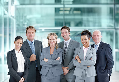 Buy stock photo Positive group of businesspeople standing together and smiling - portrait 
