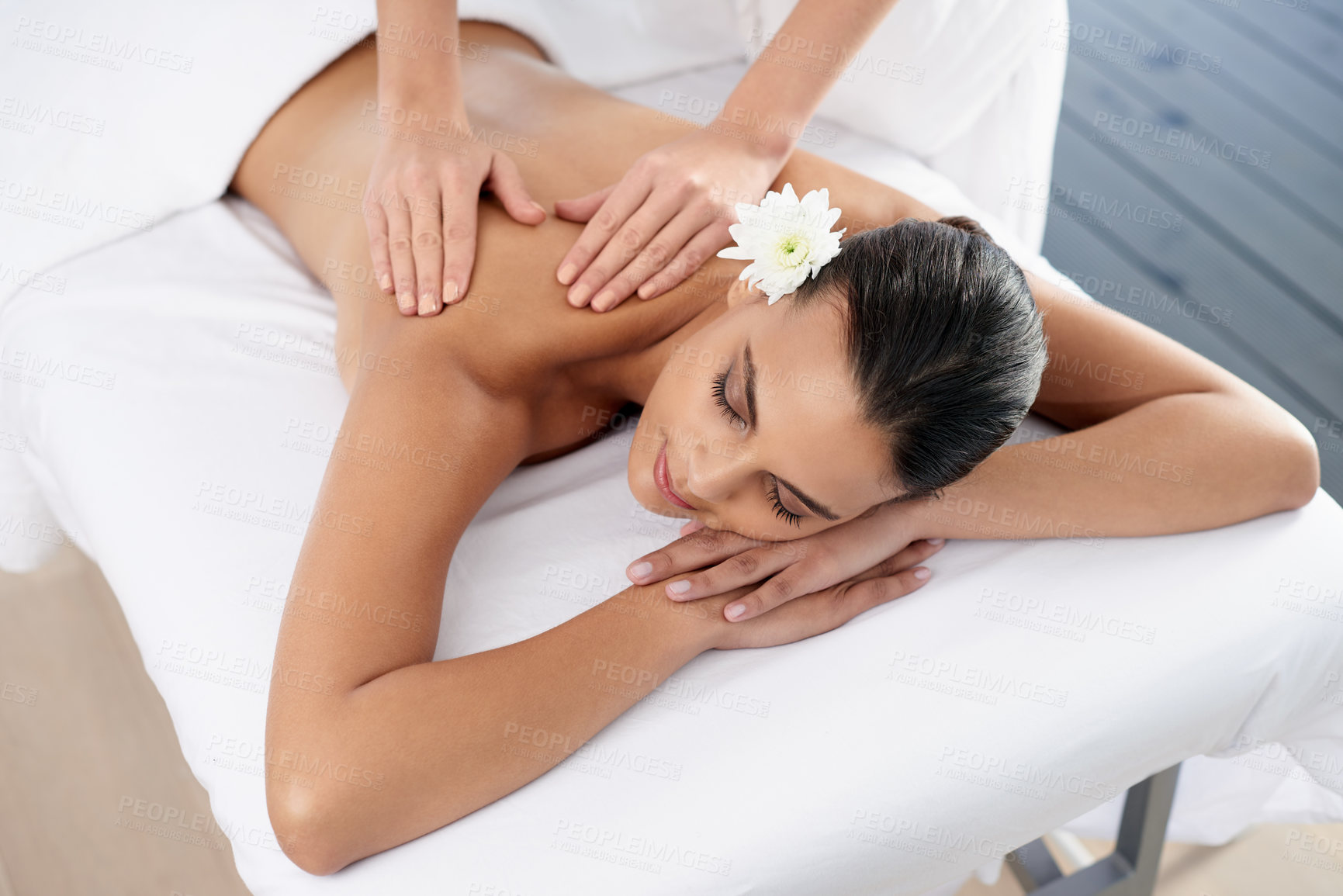 Buy stock photo Woman, back massage and body treatment for relaxing, wellness and muscle therapy for bodycare. Female person, masseuse and health by dermatology, calm and resting at resort hotel and peace or zen