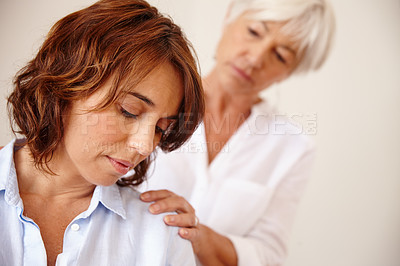Buy stock photo Shot of a senior woman comforting her daughter who's going through a difficult time