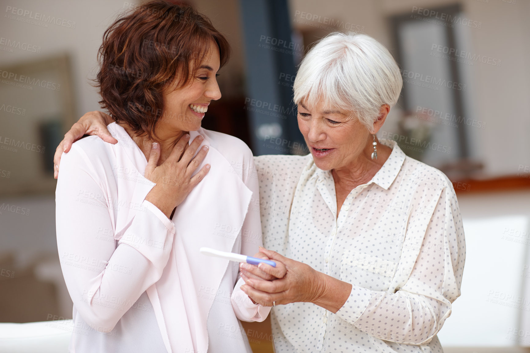 Buy stock photo Women, hug and excited with pregnancy test, family and sharing good news with senior parent in home. Happy, people and stick with positive results, embrace and celebration for IVF success in house
