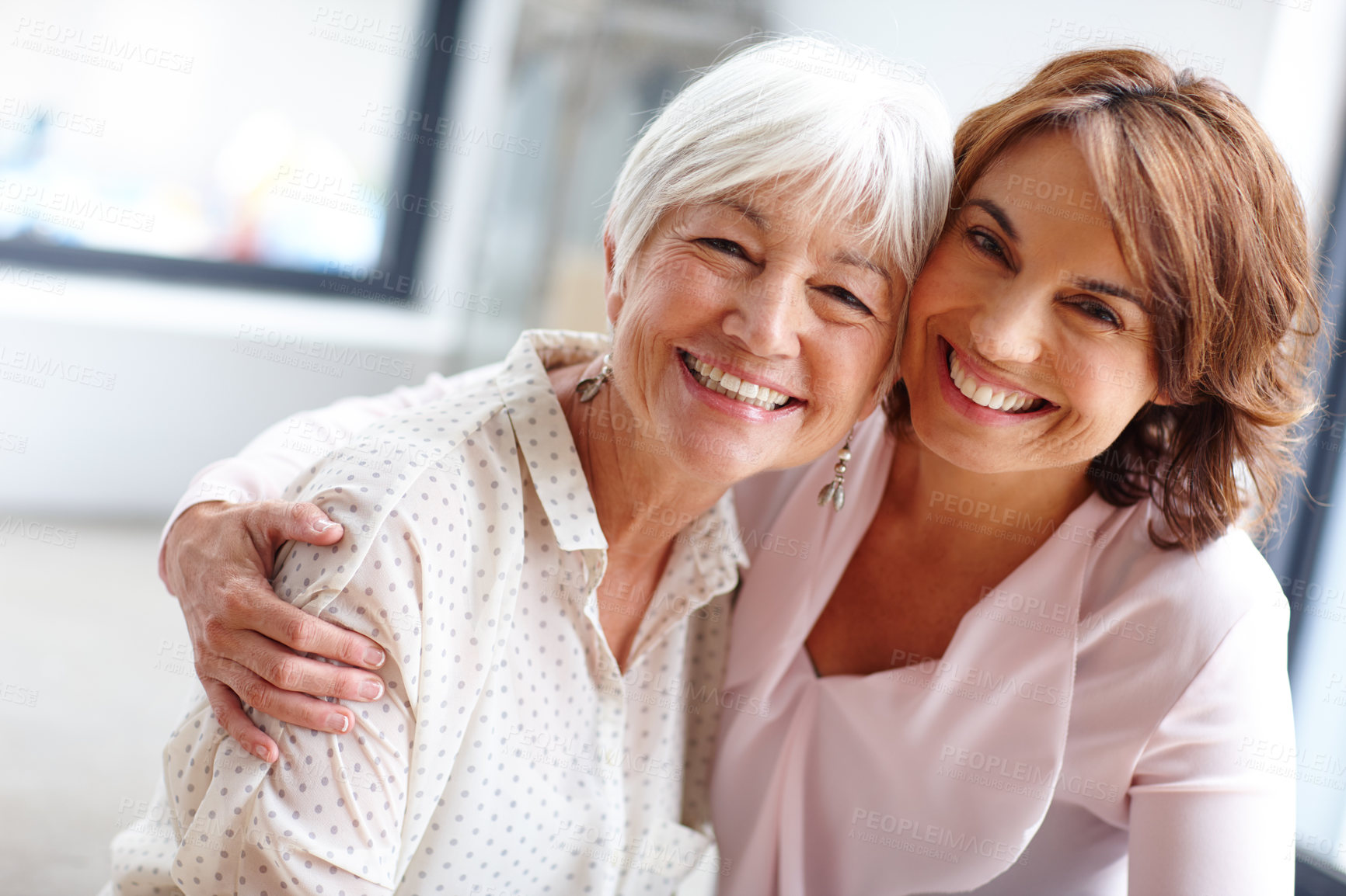 Buy stock photo Shot of a woman spending time with her elderly mother