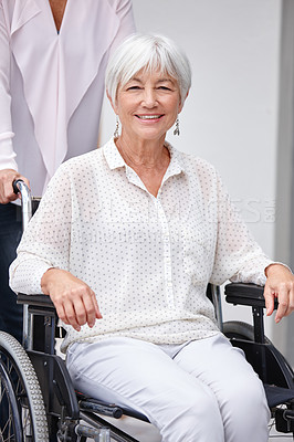 Buy stock photo Cropped shot of a senior woman being pushed in a wheelchair