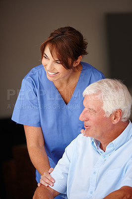 Buy stock photo Cropped shot of a female nurse standing beside her senior patient