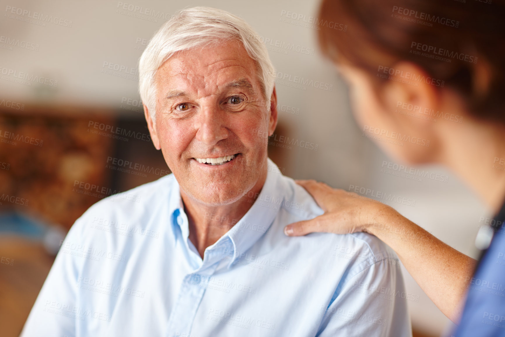 Buy stock photo Cropped shot of a female nurse checking on her senior patient