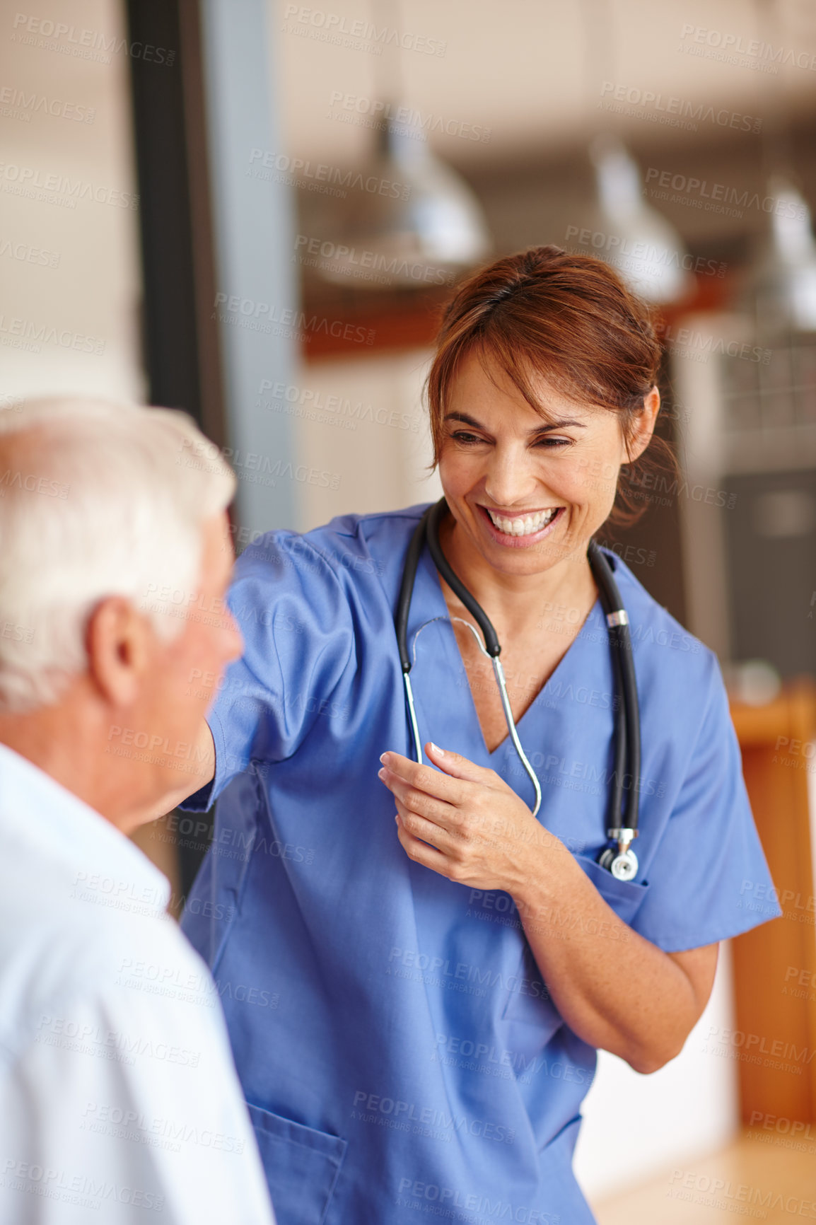 Buy stock photo Cropped shot of a female nurse checking on her senior patient