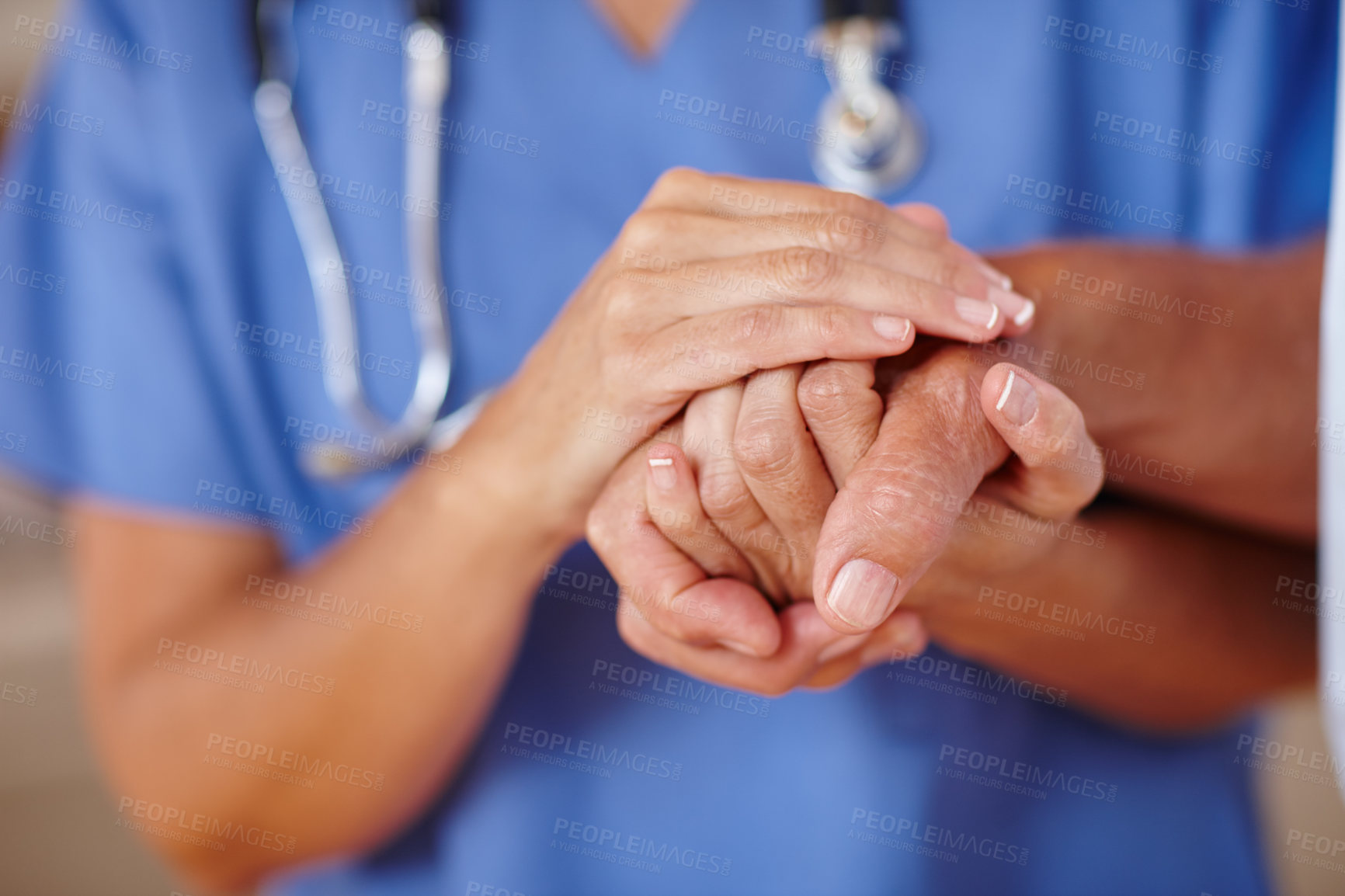 Buy stock photo Cropped shot of a healthcare worker holding a senior patient's hands