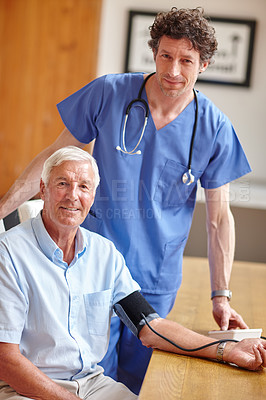 Buy stock photo Portrait of a doctor monitoring a senior patient's blood pressure