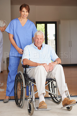 Buy stock photo Shot of a female doctor standing with her senior patient who's in a wheelchair