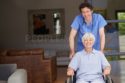 Buy stock photo Cropped shot of a doctor pushing his senior patient in a wheelchair